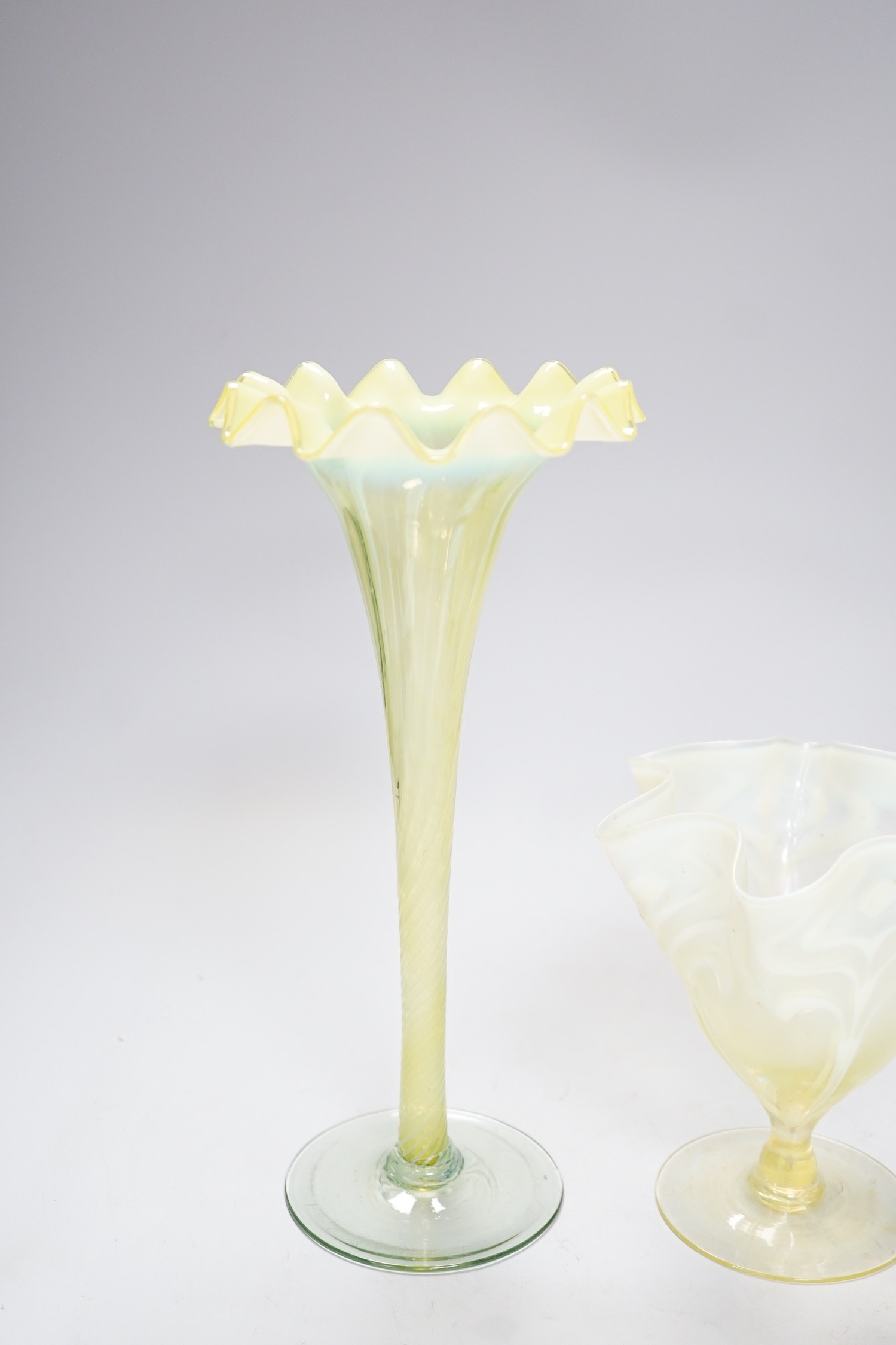 Two early 20th century vaseline glass vases, tallest 29cm